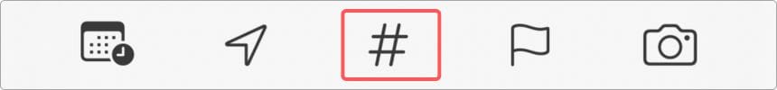 Screenshot of the Apple Reminders keyboard toolbar highlighting the hashtag button used to add tags to list items, making it easy to label grocery items by store.