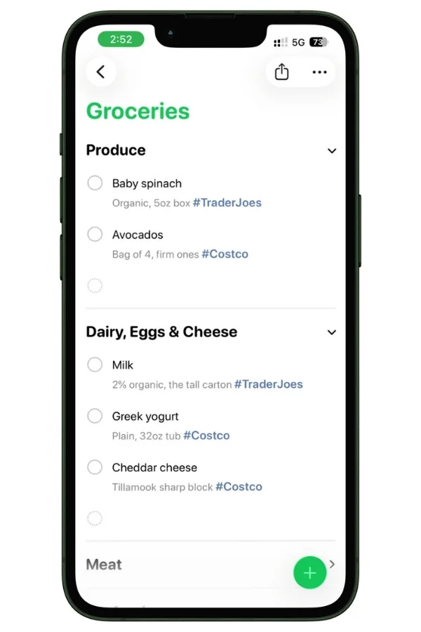 Screenshot showing grocery items tagged with store names in Apple Reminders.